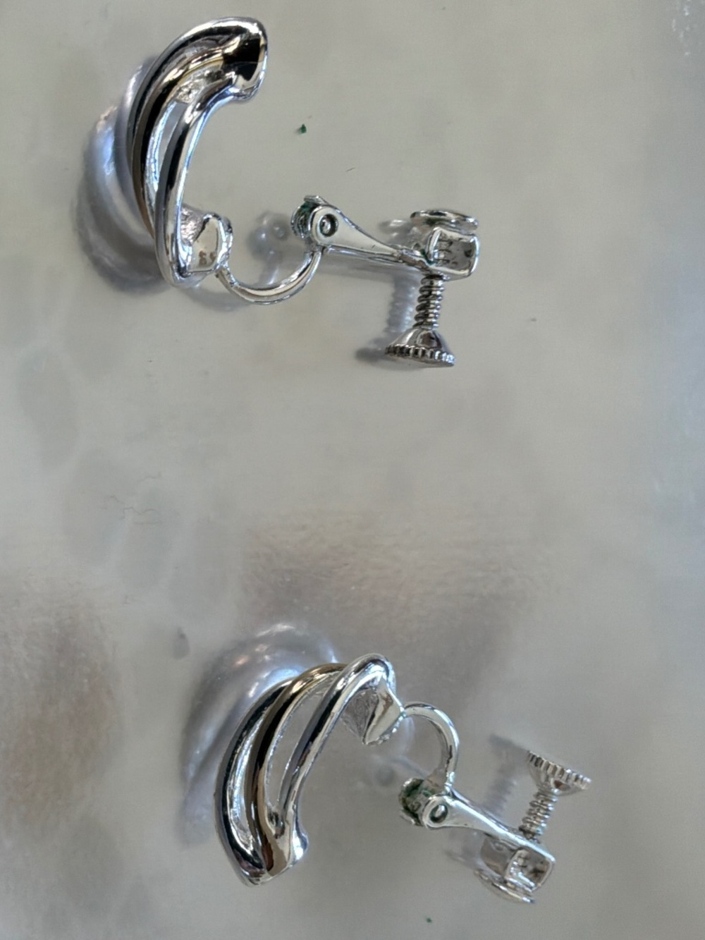 Authentic and highly collectible vintage 1970s open-work "Swirl Wing" clip-on ea